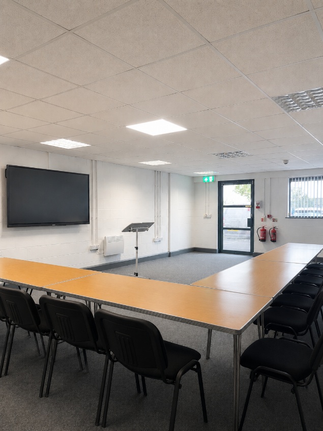 Room with presentation screen and equipment